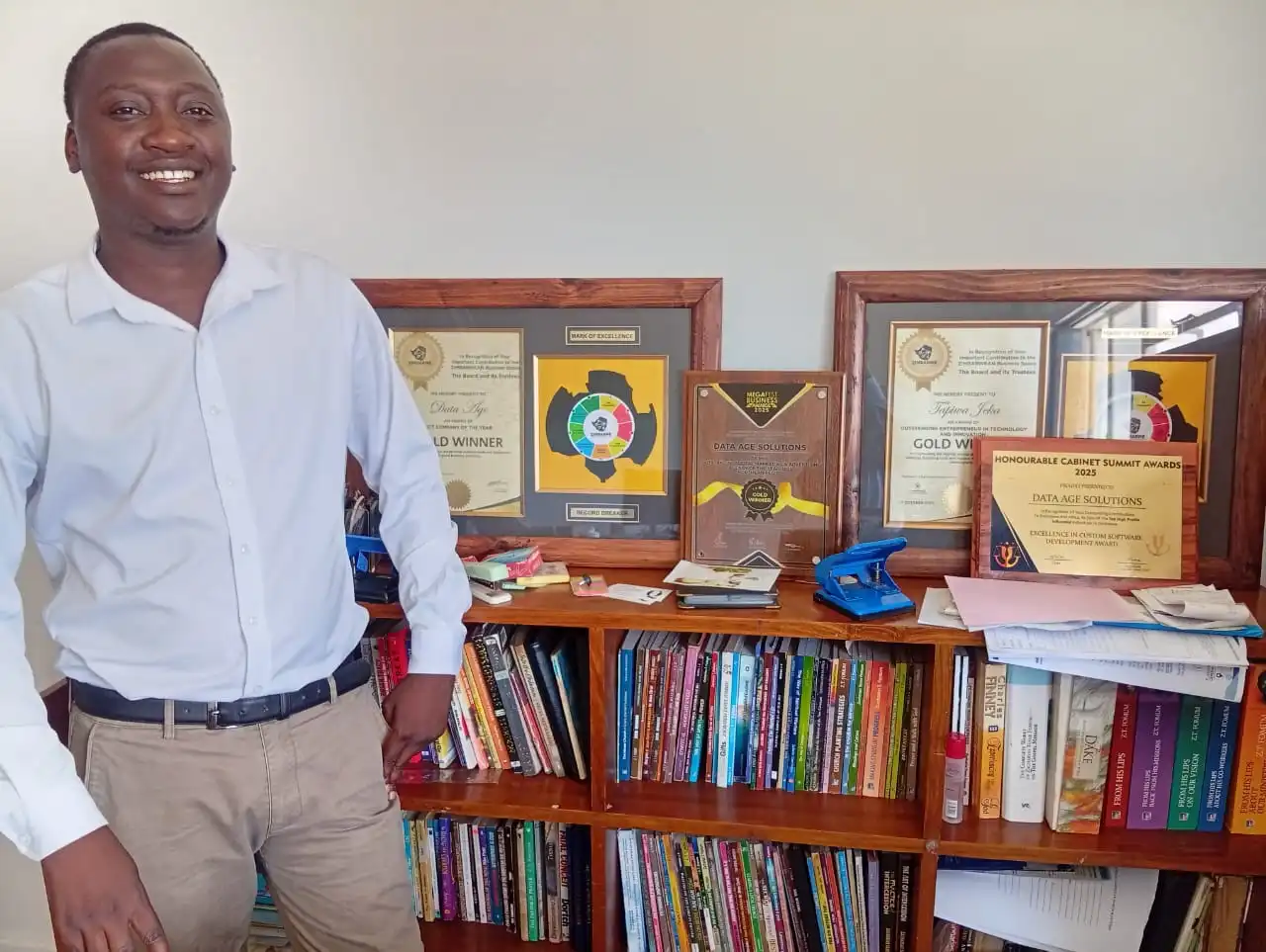 Walter K Mwanyisa with five industry awards on display
